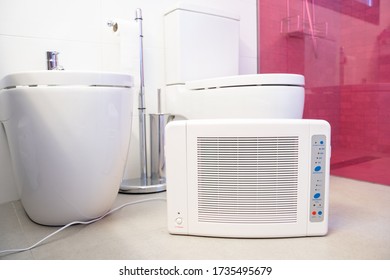 Ozone Machine Generator Inside A Bathroom. Home Cleaning And Disinfection During Covid 19 Epidemic. Domestic Safety Equipment.