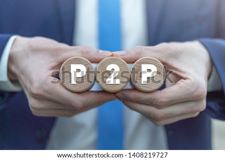P2P peer to peer technology web network business concept on a wooden cylinders in a businessman hands.