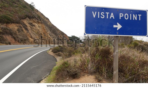 Pacific coast highway 1, Vista point road sign\
on Cabrillo road along ocean, California journey, Big Sur, USA.\
Coastal trip, traveling on car by sea, tourist route. Yellow\
dividing line on\
asphalt.