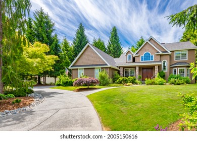 Pacific Northwest Craftsman House On Golf Course With Patio And Vibrant Sky