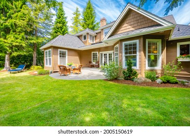 Pacific Northwest Craftsman House On Golf Course With Patio And Vibrant Sky