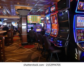 PACIFIC OCEAN - APR 27, 2022 - Slot Machines In A Cruise Ship Casino On