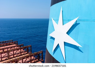 Pacific Ocean - September 05 2022: Maersk Line Logo On The Funnel Of The Container Ship, She Is Sailing Through Calm, Blue Ocean.