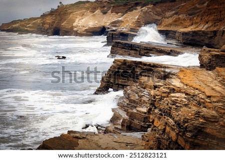 Pacific Ocean waves hit the cliffs at Point Loma in San Diego, California.
