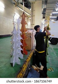 Pacific Place, Senayan, Kebayoran Baru, South Jakarta, December 3, 2020: The Young People Are Repairing The Tree Christmas At Pacific Place, Senayan, Kebayoran Baru, South Jakarta On December 3, 2020