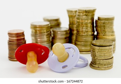 pacifier with hard money  in light background.