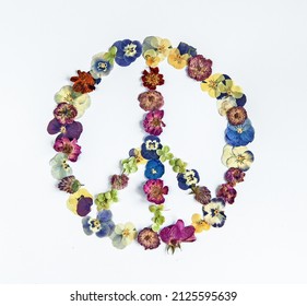 Pacifist Sign Made Of Colorful Flowers On A White Background
