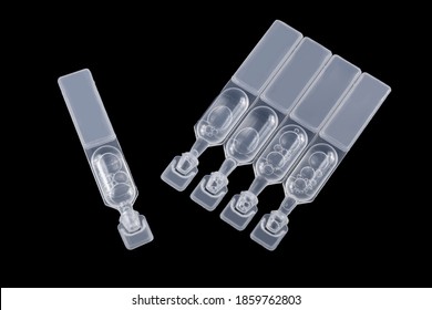 Pack Of Artificial Tear Single Use Containers Isolated On Black. Eye Care Concept. Dry Eye Treatment