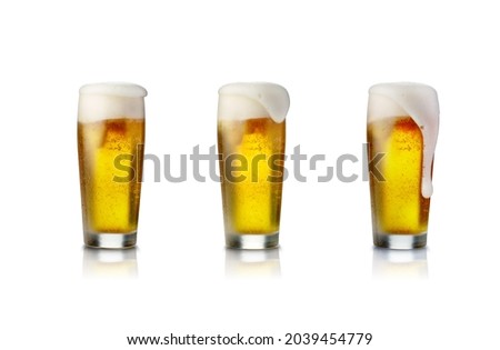 Pack of Beer glass isolated on white background with foam. Foto d'archivio © 
