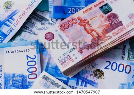 a pack of cash five thousand Russian money close-up on the background of two thousand bills