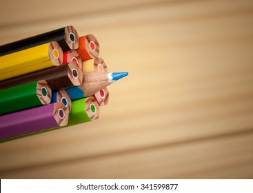 Pack Of Color Pencils With A Single Sharp One Symbolizing Leadership Concept And Unique Approach By Standing Out Of The Crowd Group Elements
