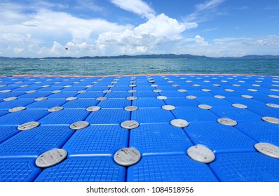 Pack Group of Blue Cubes Float on clear Ocean beautiful beach for tourist to walk from boat in Summer travel holiday. New Concept of bridge and floating docking in tropical Island