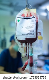 Pack Red Cell Blood Transfusion Bag Hanging On Infusion Stand In Emergency Or Operation Room In The Hospital, Giving To The Pale Patient For Blood Replacement And Treatment Of Shock, Acute Blood Loss