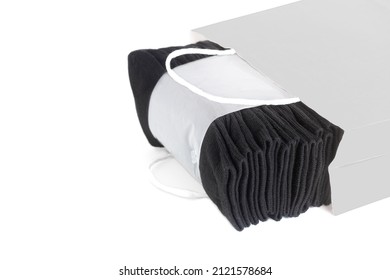 Pack Of Ten Black Socks In A Gray Shopping Bag Isolated On White. Buying Fresh Underwear.