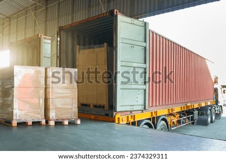 Package Boxes Wrapped Plastic Stacked on Pallets Loads into Container Trucks. Loading Dock Warehouse Shipping. Supply Chain, Shipment Goods. Freight Truck Logistic, Cargo Transport.