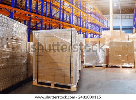 Package Boxes Wrapped Plastic Stacked on Pallets in Warehouse. Tall Shelve Storage Warehouse. Supply Chain, Supplies Shipment. Warehouse Shipping Logistics.	