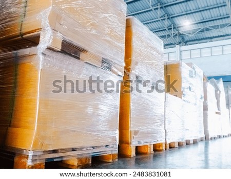 Package Boxes Wrapped Plastic Stacked on Pallets in Warehouse. Bulk Pallets in Storage Warehouse. Supply Chain, Supplies Shipment. Warehouse Shipping Logistics.	
