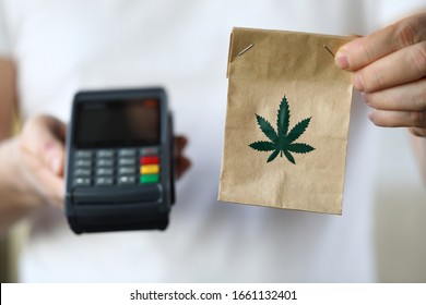 Package delivery with marijuana, payment terminal. Use and storage medical marijuana. Legalized narcotic herb. Treating pain, stress and insomnia. Registered medical hemp delivery agent