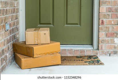 Package delivery on doorstep. Boxes and postal delivery on modern brick home doorstep on front porch