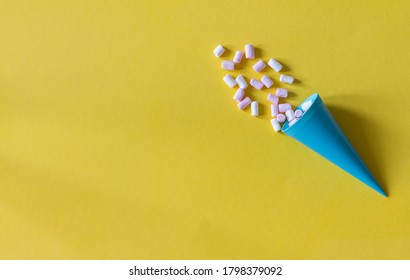 package with marshmallows on a yellow background