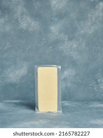 Packaged Cheddar Cheese. Cheese package. Vertical view. Fresh Stager.
