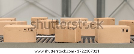 Packages delivery, packaging service and parcels, cardboard boxes on conveyor belt in warehouse, transportation system concept image