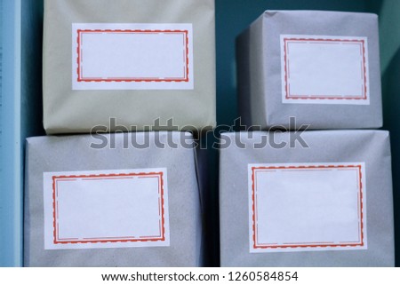Packages with empty / unsigned labels. Supporting photo for works on courier services, transportation and logistics.