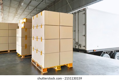 Packaging Boxes Stacked on Pallets Load with Shipping Cargo Container. Delivery Trucks Loading at Dock Warehouse. Supply Chain. Shipment Boxes. Distribution Warehouse Freight Truck Transport Logistics