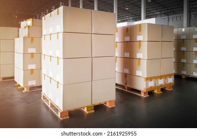 Packaging Boxes Stacked on Pallets in Storage Warehouse. Cartons Cardboard Boxes. Supply Chain. Storehouse Distribution. Shipping Supplies Warehouse Logistics.	
				