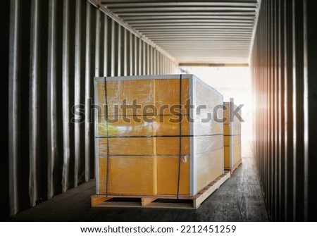 Packaging Boxes Stacked on Pallets Inside Cargo Container. Shipment Boxes Loading Trucks. Shipping Supplies Warehouse Goods. Freight Truck Transport Logistics