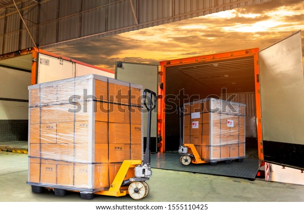 Packaging Boxes Wrapped Plastic Stacked on\
Pallets Loading into Cargo Container. Shipping Trucks. Supply\
Chain. Shipment Boxes. Distribution Supplies Warehouse. Freight\
Truck Transport\
Logistics.	