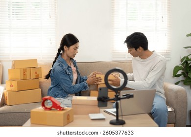 Packaging and Creativity. A couple organizing their products for an online business while sharing ideas.