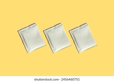 Packaging drip bag, three simple coffee isolated on colorful background. Mock up, empty plastic pack. place template for logo, text