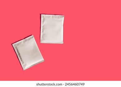 Packaging drip bag, two simple coffee isolated on colorful background. Mock up, empty plastic pack. place template for logo, text