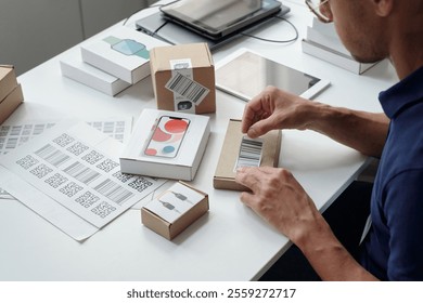 Packaging and Labeling Products in Organized Workspace - Powered by Shutterstock