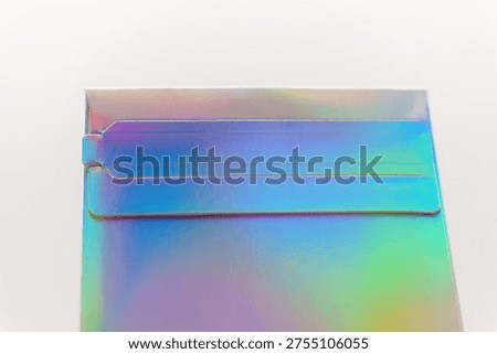 Packaging with shiny surface and tabs for secure closure