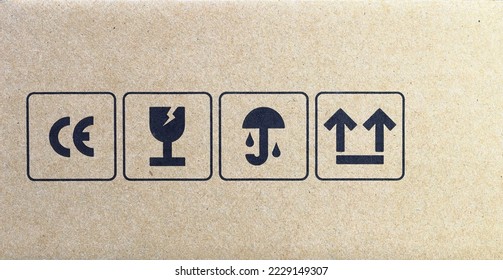 packaging symbols:  CE mark symbol, fragile or handling with care symbol, keep dry symbol and side up symbol. Collection of symbols for cardboard packaging. - Shutterstock ID 2229149307