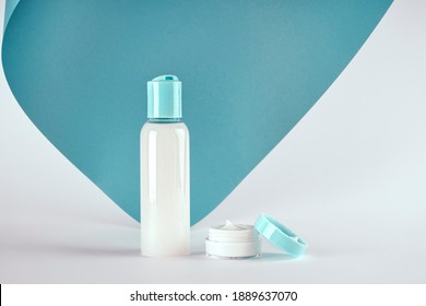 Packagings Of Cream, Lotion, Gel, Facial Foam Or Skin Care On Blue And White Background With Copy Space. Cosmetic Beauty Product Branding Mockup