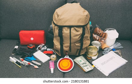 The Packed Backpack With Items Needed For Evacuation. Emergency Kit. Set Of Necessary Things In Case Of Accident Or Disaster