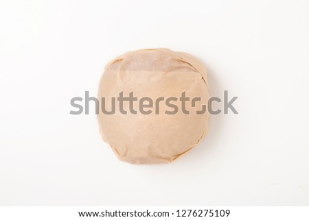 Packed burger on white background, top view. Wrapped hamburger sandwich, blank mock up