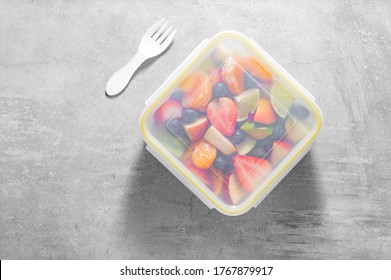 Packed Fruit Salad In Plastic Box Or Container. Healthy Meal To Go. Top View - Overhead Or From Above 