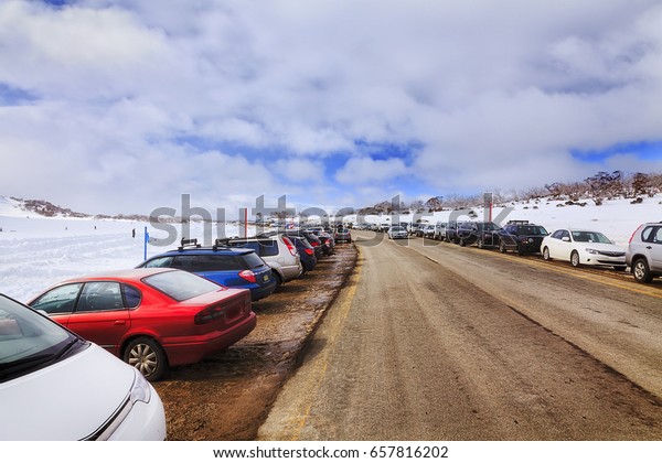 Packed parked\
cars along the road to Perisher ski resort in Perisher valley of\
Snowy Mountains in Australia.\
