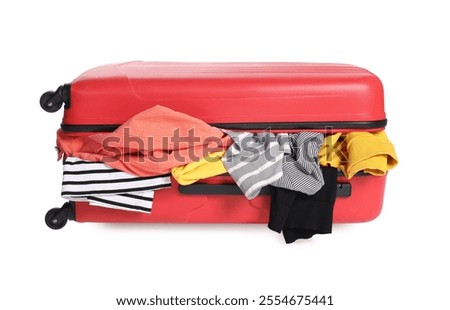 Packed suitcase full of clothes isolated on white