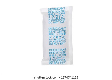 A packet of desiccant bentonite with English, Chinese and Japanese warning label 'dangerous, do not eat'. - Powered by Shutterstock