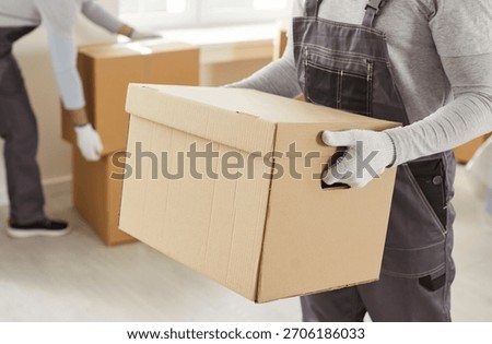 Packing boxes close up, moving delivery pack service, movers team moving cardboard boxes, loading, unloading setting up, new house stuff, carrying stacks of cardboard relocation boxes in office room
