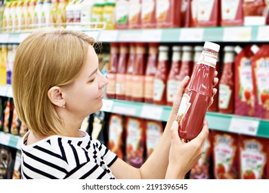 Packing of tomato ketchup in hands woman - Shutterstock ID 2191396545