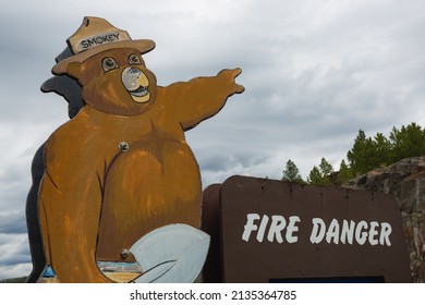 Pactola Reservoir, South Dakota - May 27, 2020: A Vintage Smokey The Bear Near The Pactola Dam And Reservoir.