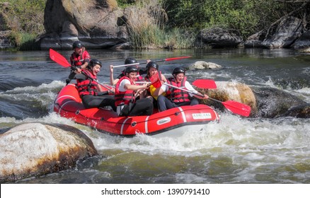 Pacuare River,  Costa Rica - March 14 2019: Rafting Team , Summer Extreme Water Sport.  Group Of People In A Rafting Boat, Beautiful Adrenaline Ride Down The River.