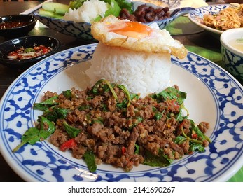 Pad Gaprao (Pad Kra Pao) Holy Basil Chicken Stir Fry. Phat kaphrao consists of meat such as pork, chicken, beef, and seafood stir fried with Thai holy basil and garlic.