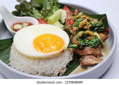 'Pad Kra Pao' - Fried pork with basil and chilli served with steam rice topped with round fried egg.